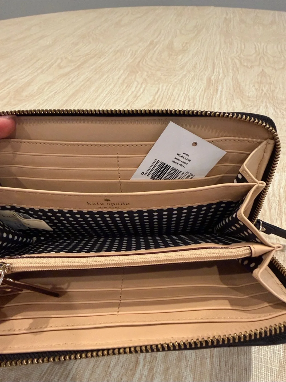 kate spade black quilted zip-around wallet with gold plaque